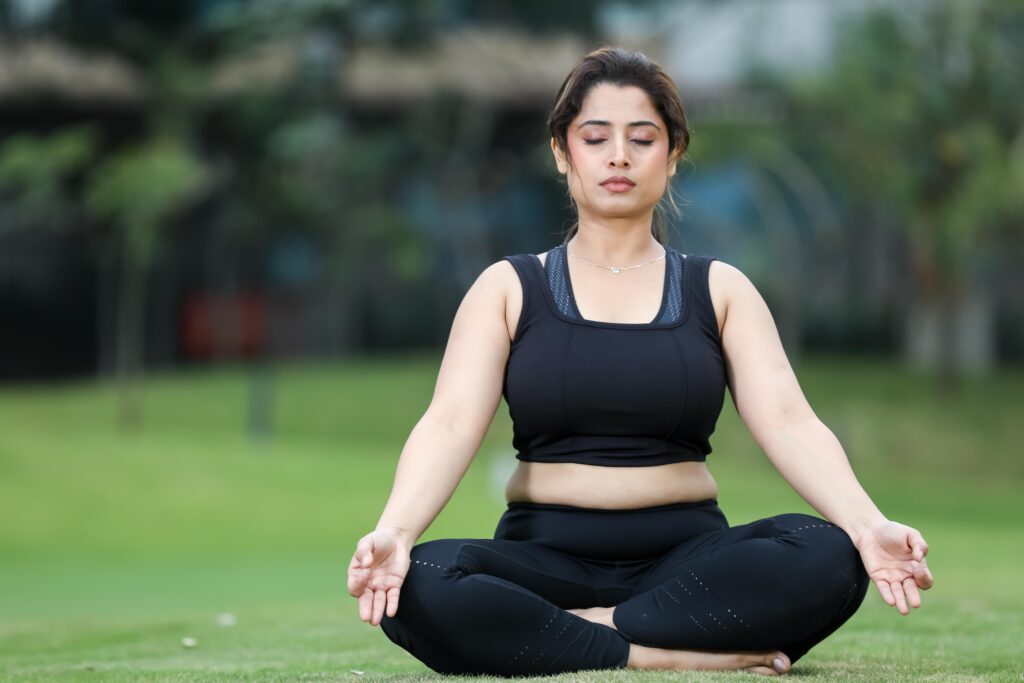Woman practicing yoga and meditation in Kochi