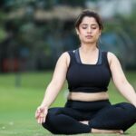 Woman practicing yoga and meditation in Kochi