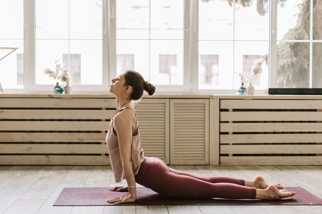 woman doing cobra pose